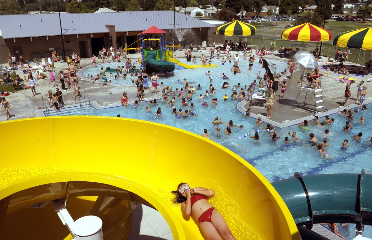 Two big slides are among the attractions at the packed Shadle pool, which  has drawn more than 6,000 swimmers since it opened July 6. (The Spokesman-Review)