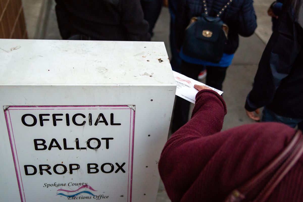 A voter casts her ballot on Oct. 22, 2018 at the downtown Spokane Public Library. (Libby Kamrowski / The Spokesman-Review)