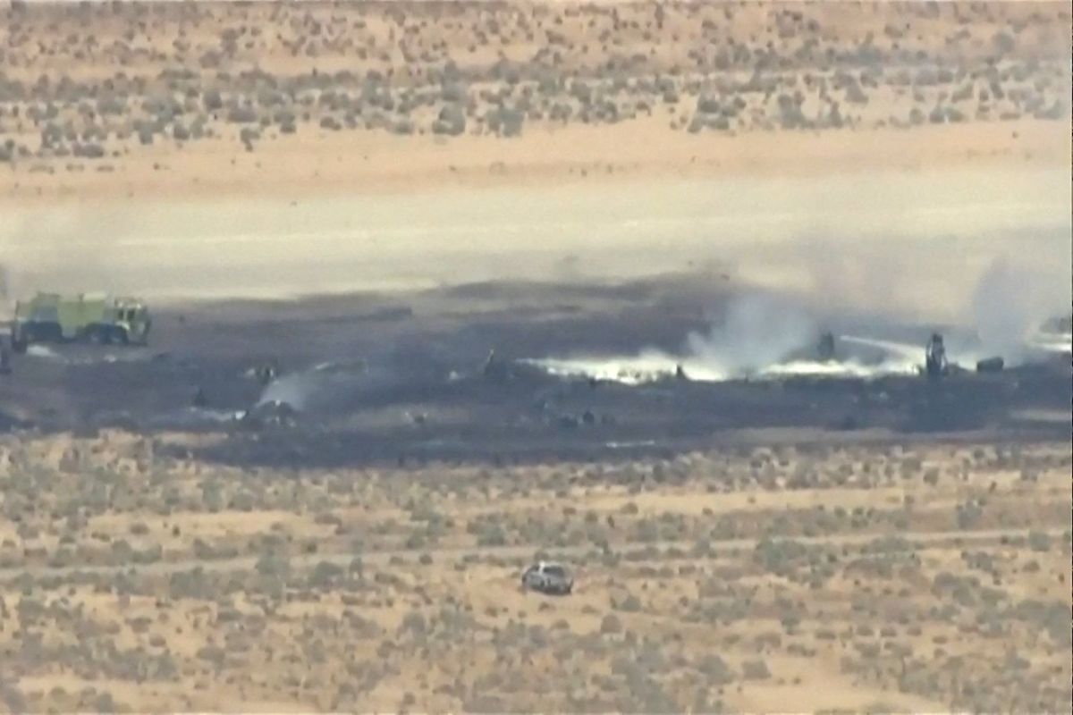 Smoke rises from a blackened part of Edwards Air Force Base after the crash of a U.S. Air Force B-52 bomber aircraft in Edwards, California, U.S., June 15, 2026, in a still image from news helicopter video.  (ABC affiliate KABC)