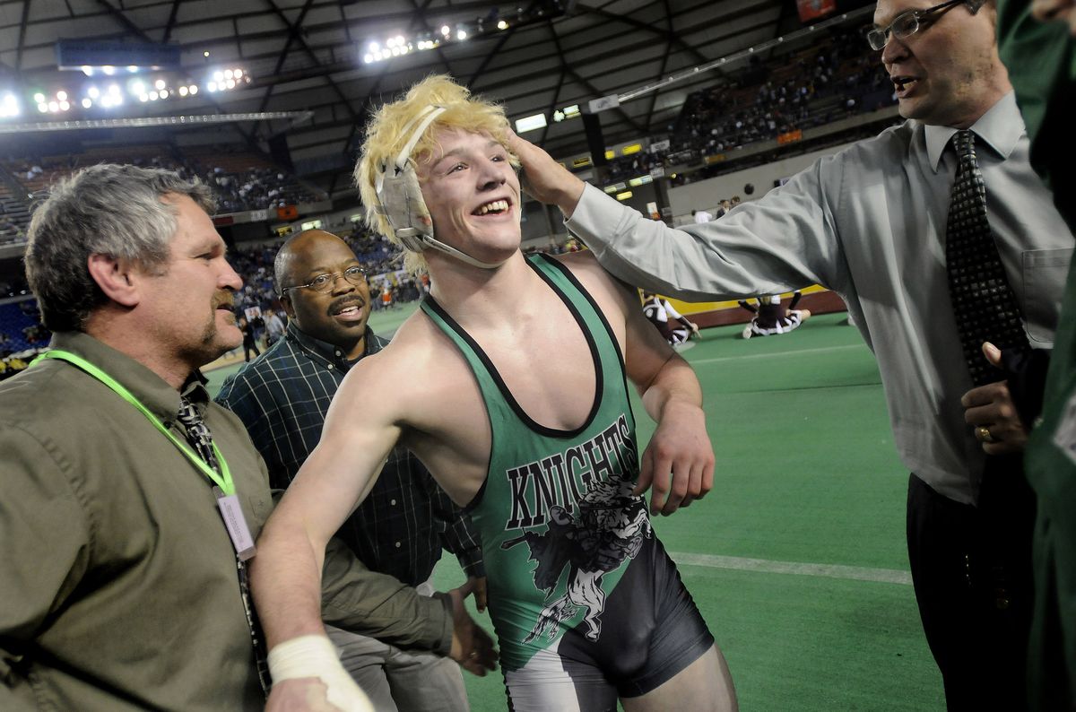East Valley’s Dakota Lawson celebrates with coaches Craig Hauson, left, and Troy Niles after defeating Ferndale’s Ryan Nelson in the 3A 189-pound division at the WIAA 2009 Mat Classic XXI state wrestling championships. (Ingrid Barrentine / The Spokesman-Review)