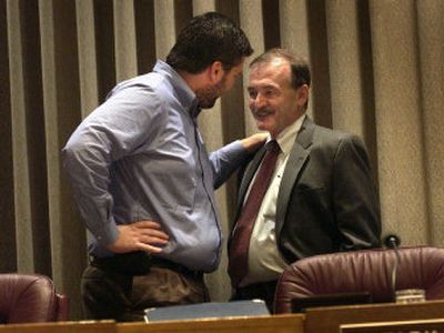 
Deputy Mayor Jack Lynch, right, is welcomed back to City Hall on Monday by Councilman Brad Stark. 
 (Brian Plonka / The Spokesman-Review)