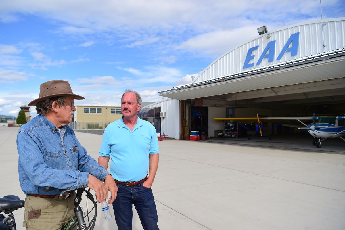 Joe Maridon, left, and Jack Hohner chat outside the hangar of the Experimental Aircraft Association at Felts Field, Tuesday, July 3, 2018. Both have built and are building airplanes in the experimental category and are involved in the local chapter of the EAA, where airplane hobbyists gather to help each other and exchange information about their hobby. (Jesse Tinsley / The Spokesman-Review)