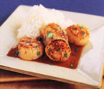 
 Sea Scallops in Sweet Chili Sauce are served with steamed rice.
 (Associated Press / The Spokesman-Review)