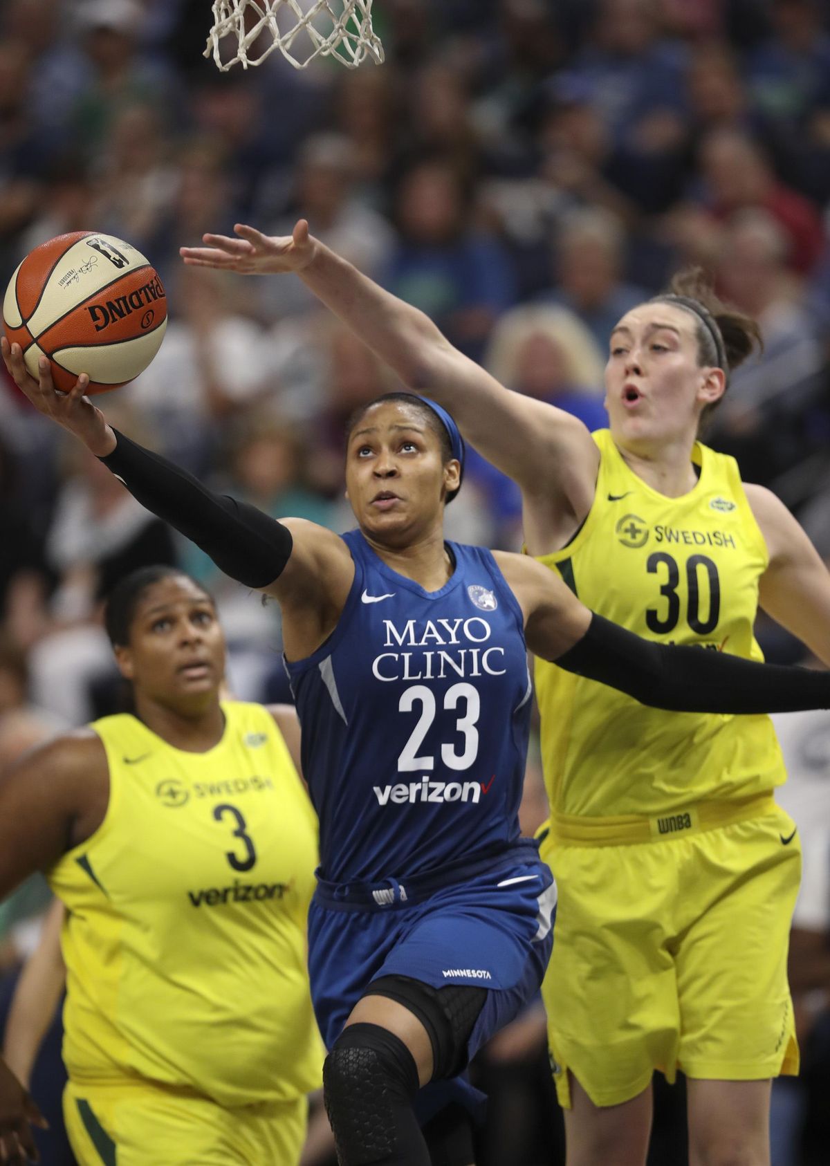 Minnesota Lynx forward Maya Moore (23) shoots as Seattle Storm forward Breanna Stewart (30) defends during the first half of a WNBA basketball game Tuesday, June 26, 2018, in Minneapolis. (Jeff Wheeler / Star Tribune via AP)