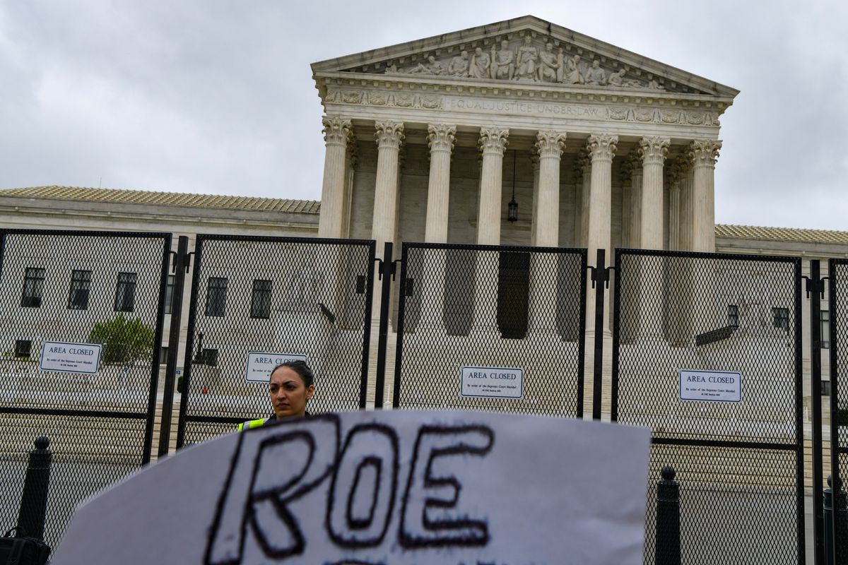 FILE -- A demonstrator outside the Supreme Court building in Washington, May 14, 2022. The Supreme Court announced on Jan. 19, 2023 that an internal investigation had failed to identify the person who leaked a draft of the opinion overturning Roe v. Wade. (Kenny Holston/The New York Times)  (KENNY HOLSTON)