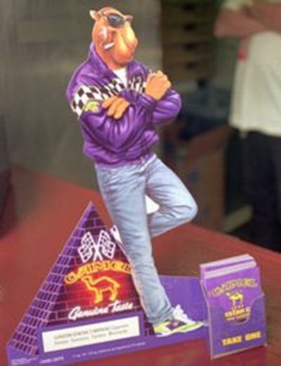 FILE--A Joe Camel advertisement sits on the counter of a concession stand in N.H., July 10, 1997. Joe Camel was a super cigarette pitchman for 10 years, a cocky figure popular with the cartoon ladies, not to mention real customers. Now he's back, but as a beast of burden. He carries all the baggage of an industry under attack for marketing to youth.(AP Photo/Andrew Sullivan)
 
