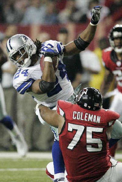 
Atlanta's Rod Coleman tackles Dallas running back Marion Barber. 
 (Associated Press / The Spokesman-Review)