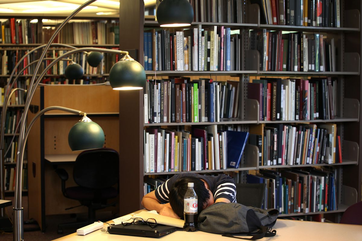 ADVANCE FOR FRIDAY, AUG. 31 - In this July 11, 2012 photo provided by the University of Michigan School of Engineering, Taewon Kim, an electrical engineering systems graduate student, sleeps in the library at the Duderstandt Center on the campus of the University of Michigan, in Ann Arbor, Mich. As college students return to campus in the coming weeks, they�ll be showered in the usual handouts of coupons, condoms, and credit cards. But some schools are also giving students what a growing body of research reveals could make a huge difference in their college careers: ear plugs, sleep shades and napping lessons. (Marcin Szczepanski / Michigan Engineering Communications & Marketing)