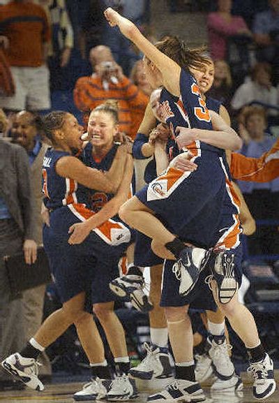 
The Waves celebrate their WCC tournament championship. 
 (Brian Plonka / The Spokesman-Review)