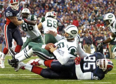 
Vinny Testaverde, the New York Jets' 41-year-old quarterback, endures a sack during an Oct. 16 game against the Buffalo Bills. 
 (Associated Press / The Spokesman-Review)