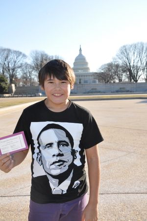 Dustin Major, an 11 year old sixth grader at Roosevelt Elementary School in Spokane, WA, picks up his pass to the Inauguration of the 44th President of the United States, Barack Obama, from Senator Maria Cantwell and surveys the site at the U.S. Capitol on January 16, 2009. (Tom Keefe, Special to The Spokesman-Review)