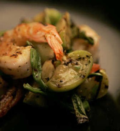 
Quickly grill tomatillos so they're crisp-tender, then toss them with quick-grilled scallions, serrano chili and marinated, grilled shrimp. Divide the mixture among freshly warmed tortillas, add a side dish and supper is served.Los Angeles Times
 (Los Angeles Times / The Spokesman-Review)