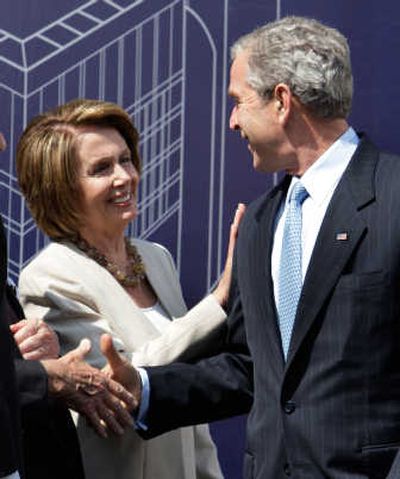 
House Speaker Nancy Pelosi, of California, joins President Bush in a groundbreaking  at the U.S. Institute of Peace on Thursday. Associated Press
 (Associated Press / The Spokesman-Review)