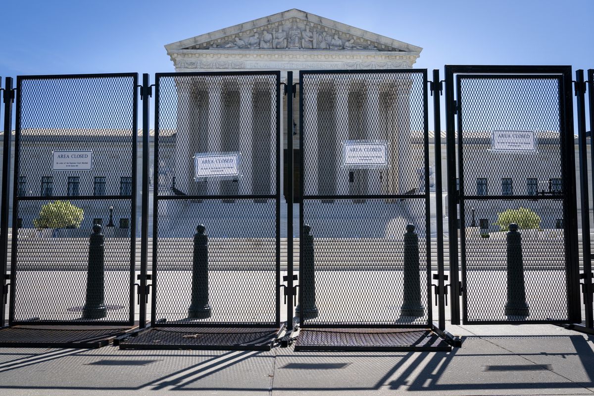FILE - Anti-scaling fencing blocks off the Supreme Court, May 10, 2022, in Washington.  (Jacquelyn Martin)