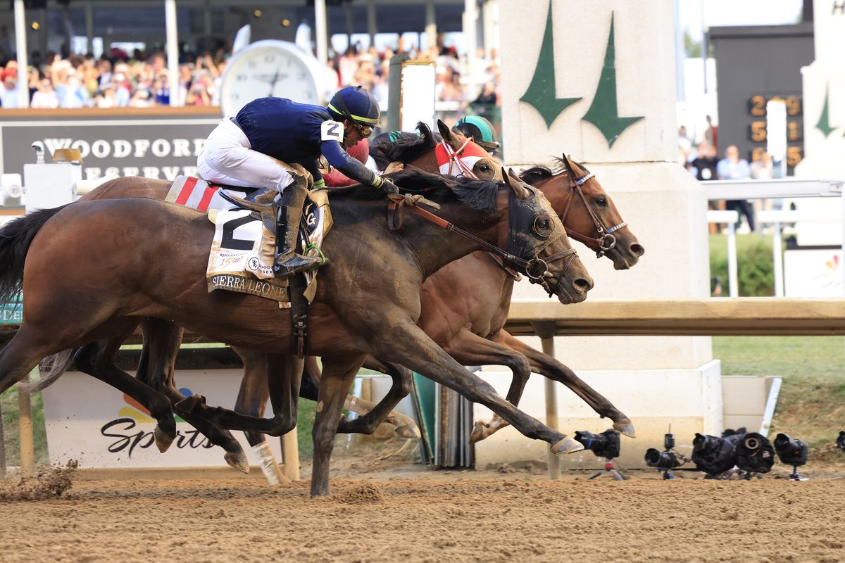 Mystik Dan, ridden by jockey Brian J. Hernandez Jr., crosses the finish line first by a nose to win the 150th running of the Kentucky Derby at Churchill Downs on Saturday.  (Getty Images)
