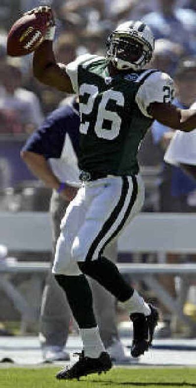 
New York Jets safety Erik Coleman celebrates an interception against the San Diego Chargers on Sept. 19.
 (Associated Press / The Spokesman-Review)