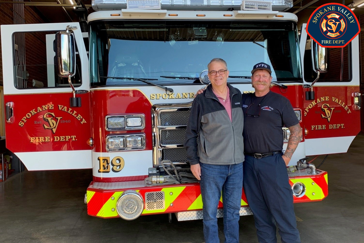 Heart attack survivor Brad Garrett, left, and Spokane Valley firefighter Brook Brown are pictured in this undated photo. Brown was part of a crew that was able to revive Garrett.  (Courtesy photo)