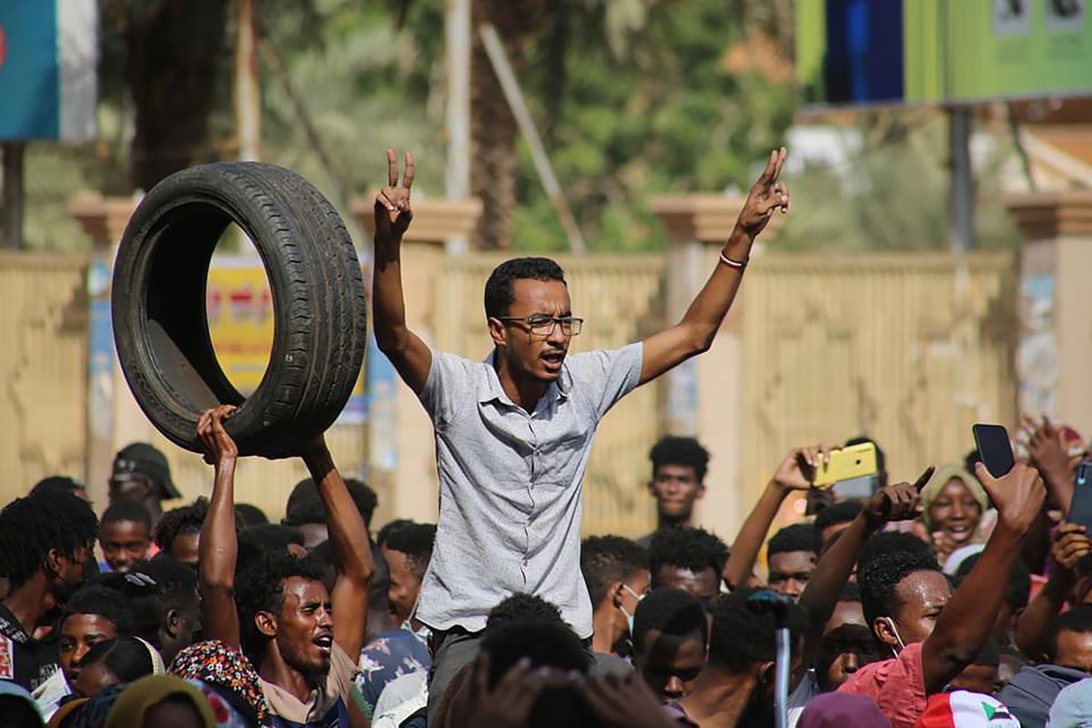 Thousands of pro-democracy protesters take to the streets to condemn a takeover by military officials in Khartoum, Sudan, Monday Oct. 25, 2021. Sudan’s military seized power Monday, dissolving the transitional government hours after troops arrested the acting prime minister and other officials. The takeover comes more than two years after protesters forced the ouster of longtime autocrat Omar al-Bashir and just weeks before the military was expected to hand the leadership of the council that runs the African country over to civilians.  (Ashraf Idris)