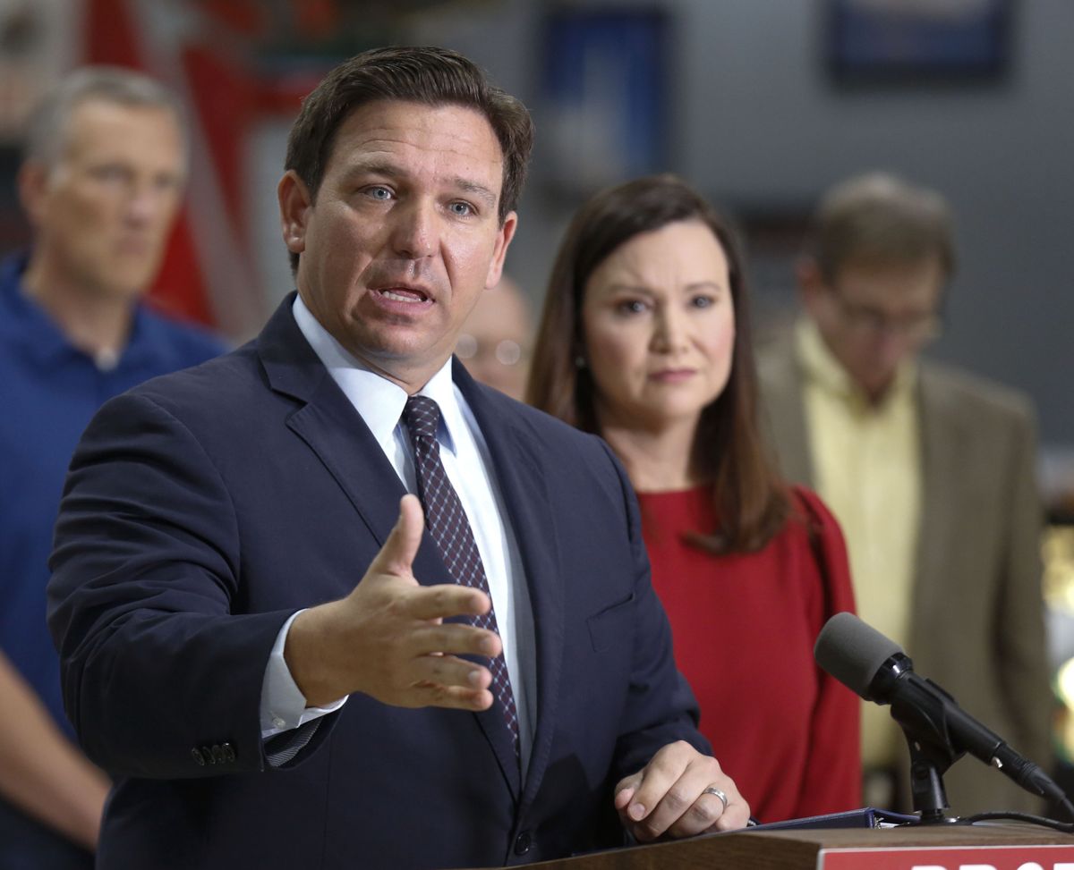 Florida Governor Ron DeSantis, flanked by Attorney General Ashley Moody, addresses the media and supporters Oct. 28 in Lakeland Fla. (Calvin Knight)