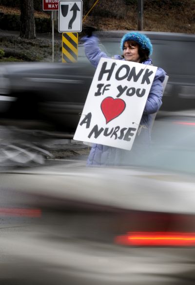 Barb Ormsby, a cardiac nurse for 23-years at Sacred Heart Medical Center, joined dozens of other Sacred Heart nurses who held an informational picket on S. McClellan St. to protest working conditions at the hospital Tuesday Feb. 2, 2010. The nurses are upset about bathroom breaks, staffing levels and a move to change their retirement benefits from the security of a pension to a stock market based plan to a 401(k). (Colin Mulvany / The Spokesman-Review)