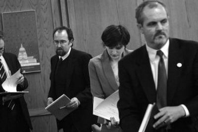 
From left, defense attorneys Tim Trageser and Marla Polin, and Assistant Attorney General Malcolm Ross prepare to confer Thursday. 
 (Holly Pickett / The Spokesman-Review)