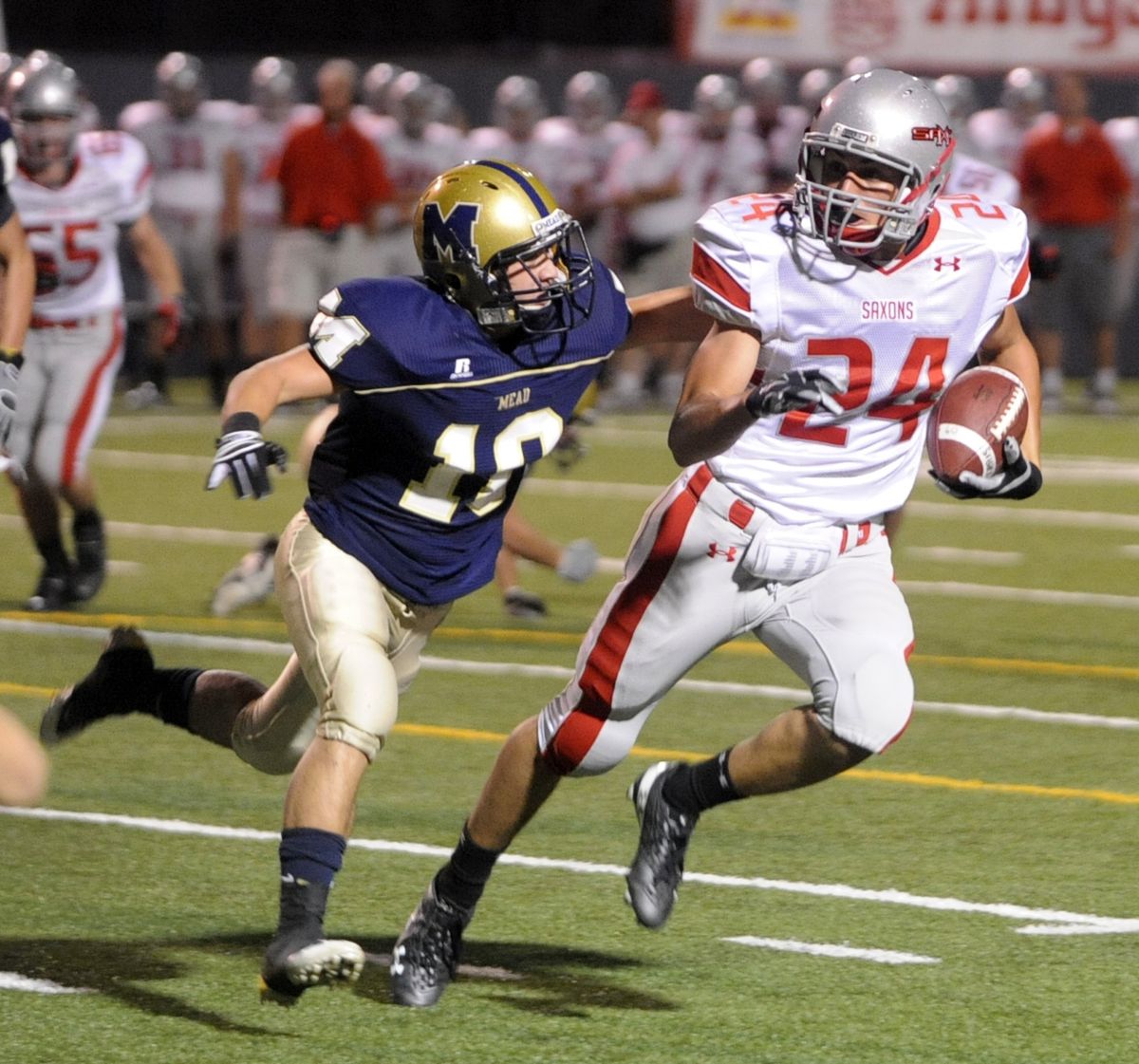 Mead’s Brendon Myers, left, had his hands full against Ferris wide receiver Jordan Tonani. (Jesse Tinsley)