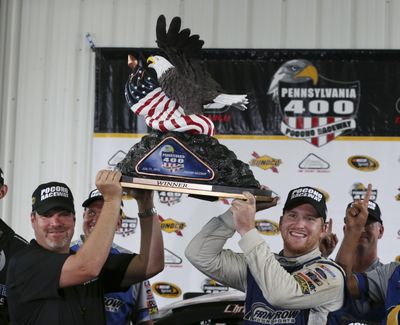 Chris Buescher, right, is all smiles after winning his first Sprint Cup Series race. (Mel Evans / Associated Press)