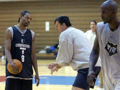 
Kevin McHale, center, doesn't limit his duties to front office. Here, he works with Latrell Sprewell, left, and Kevin Garnett. Kevin McHale, center, doesn't limit his duties to front office. Here, he works with Latrell Sprewell, left, and Kevin Garnett. 
 (Associated PressAssociated Press / The Spokesman-Review)