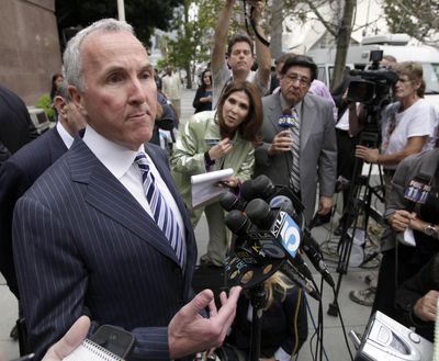 Los Angeles Dodgers owner Frank McCourt speaks to media outside court Friday in Los Angeles. (Associated Press)