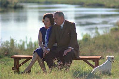 
Lady Bird Johnson and President Lyndon B. Johnson sit near a river at the LBJ Ranch in 1967. Associated Press file photos
 (Associated Press file photos / The Spokesman-Review)