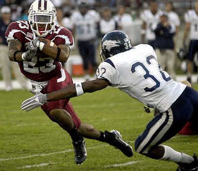 
Nevada's Kenny Viser moves in to tackle  Tonny Glynn. Associated Press
 (Associated Press / The Spokesman-Review)