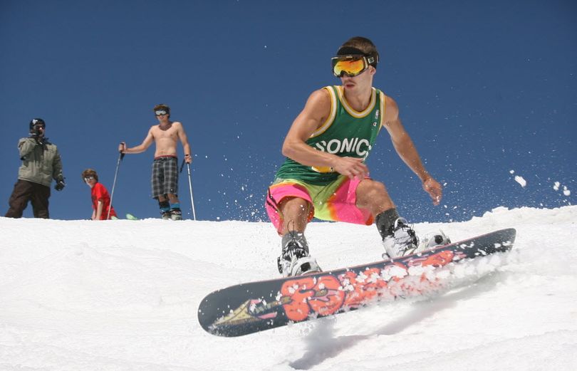 Mathew McCormack of Bellevue, Wash., drops into the upper bowl at Crystal Mountain Ski Area on Saturday, July 2, 2011. The resort is ending its record-setting season on July 16, 2011.  (Associated Press)