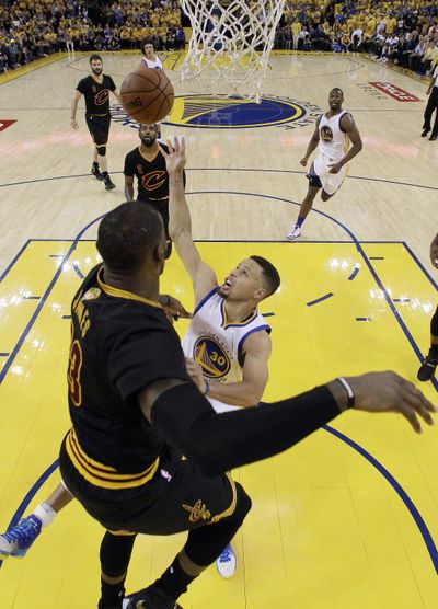 Golden State’s  Stephen Curry, right, and  Cleveland’s  LeBron James will mix it up again on Thursday in Cleveland. (Marcio Jose Sanchez / Associated Press)