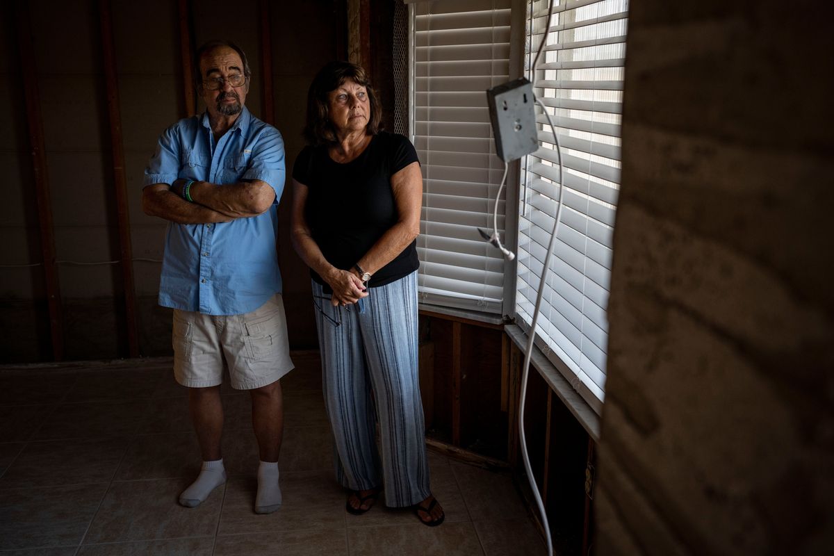Terry and Mary Sebastian at their damaged home in Rotonda West, Fla., in March, five months after Hurricane Ian ravaged the area. MUST CREDIT: Washington Post photo by Thomas Simonetti  (Thomas Simonetti/For The Washington Post)