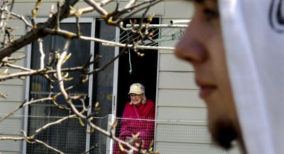 Mary Richards, 88, of Post Falls has donated the use of her garden to students from New Visions alternative high school, including Robert Wigen, right. The students were at the site on  April 30.  (Kathy Plonka / The Spokesman-Review)