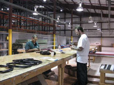 
Inmates Adam Zamudio, left, and Wayne Jensen work for Kimco Inc., which employs 10 to 15 inmates in the warehouse. 
 (BETSY Z. RUSSELL / The Spokesman-Review)