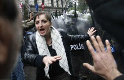 
Security forces and anti-government protesters clash outside parliament in Tbilisi, Georgia, on Wednesday. Associated Press
 (Associated Press / The Spokesman-Review)