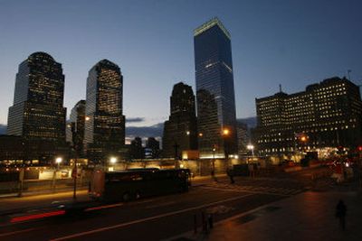 
7 World Trade Center, center right, the last building to collapse as a result of the World Trade Center attacks on Sept. 11, 2001, and the first to be permanently rebuilt, rises above ground zero Monday.
 (Associated Press / The Spokesman-Review)