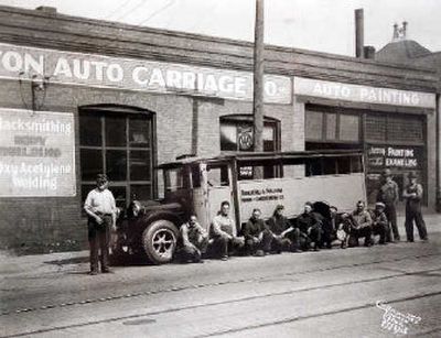 
A photo taken  in 1928 of employees of Washington Auto Carriage at its downtown location hangs on the wall at WAC's location on Broadway. 
 (The Spokesman-Review)