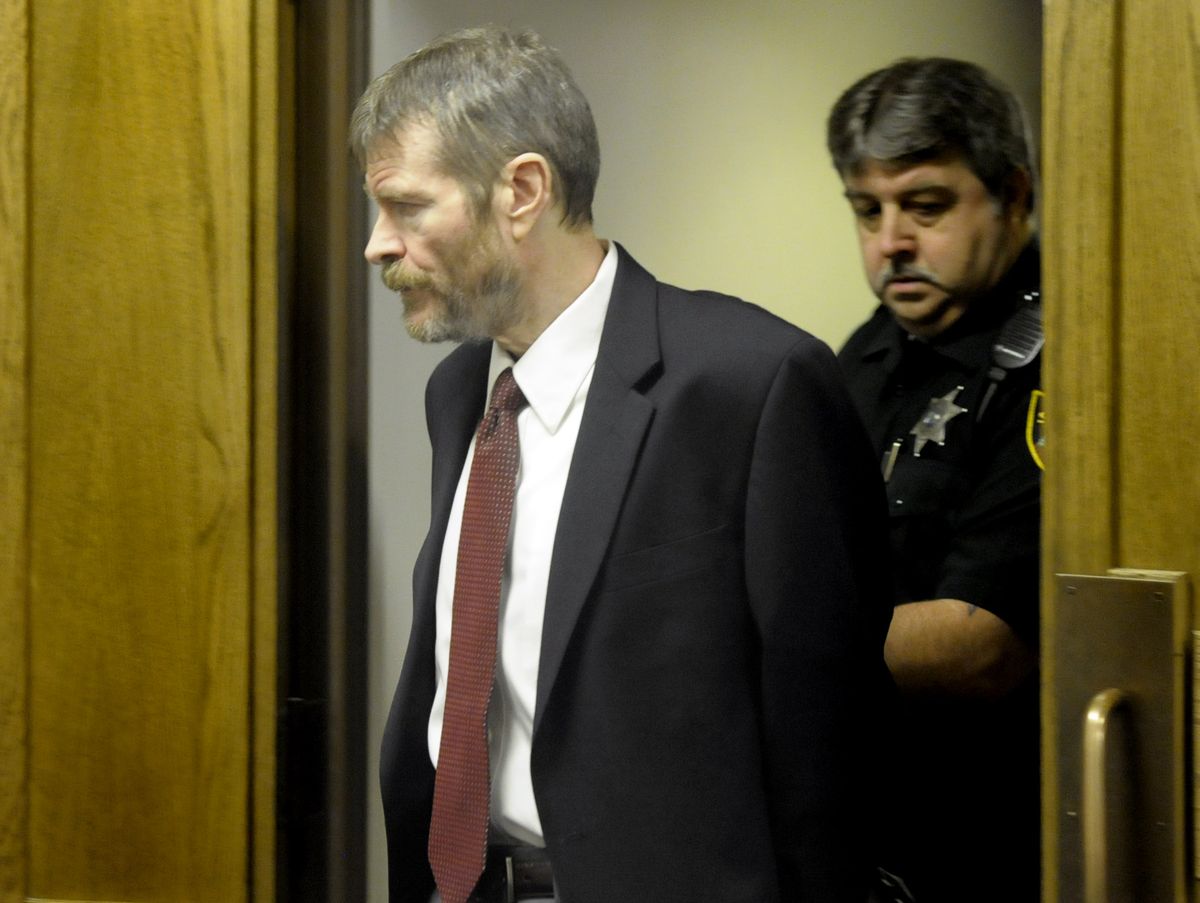 Kevin Coe is escorted from Spokane County Superior Court on Thursday during a recess in his civil commitment trial.  (CHRISTOPHER ANDERSON / The Spokesman-Review)