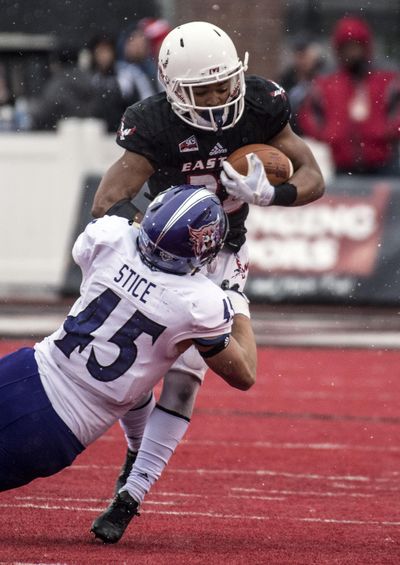 Eastern Washington running back Antoine Custer Jr. (28) shakes off Weber State linebacker Landon Stice (45) during a run play in the second half of a college football game, Sat. Nov. 4, 2017, in Cheney Wash. Colin Mulvany/THE SPOKESMAN-REVIEW (Colin Mulvany / The Spokesman-Review)