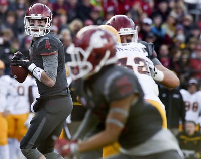 WSU quarterback Luke Falk (4) looks for an open teammate against Arizona State during the first half of a Pac-12 college football game on Saturday, Nov 7, 2015, at Martin Stadium in Pullman, Wash. (Tyler Tjomsland / The Spokesman-Review)