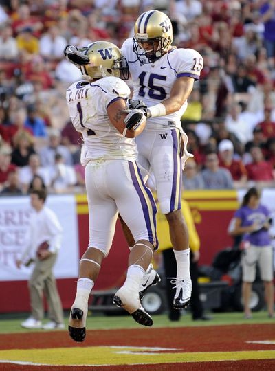 Washington wide receiver Jermaine Kearse (15) celebrates running back Chris Polk's (1) touchdown during the first half against USC in Los Angeles. (Gus Ruelas / Fr157633 Ap)