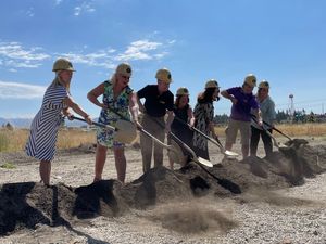 Georgia Oxford, Marnie Rorholm, David Lynch, Christina Lynch, Yvonne Johnson, Randall Johnson and Kiffen Overbay break ground on the performing arts center Saturday in Spokane Valley. (Garrett Cabeza / The Spokesman-Review)