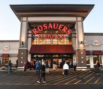 Rosauers customers line up March 19, 2020, before shopping at the grocery store on 29th Avenue in Spokane.  (Spokesman-Review photo archives)