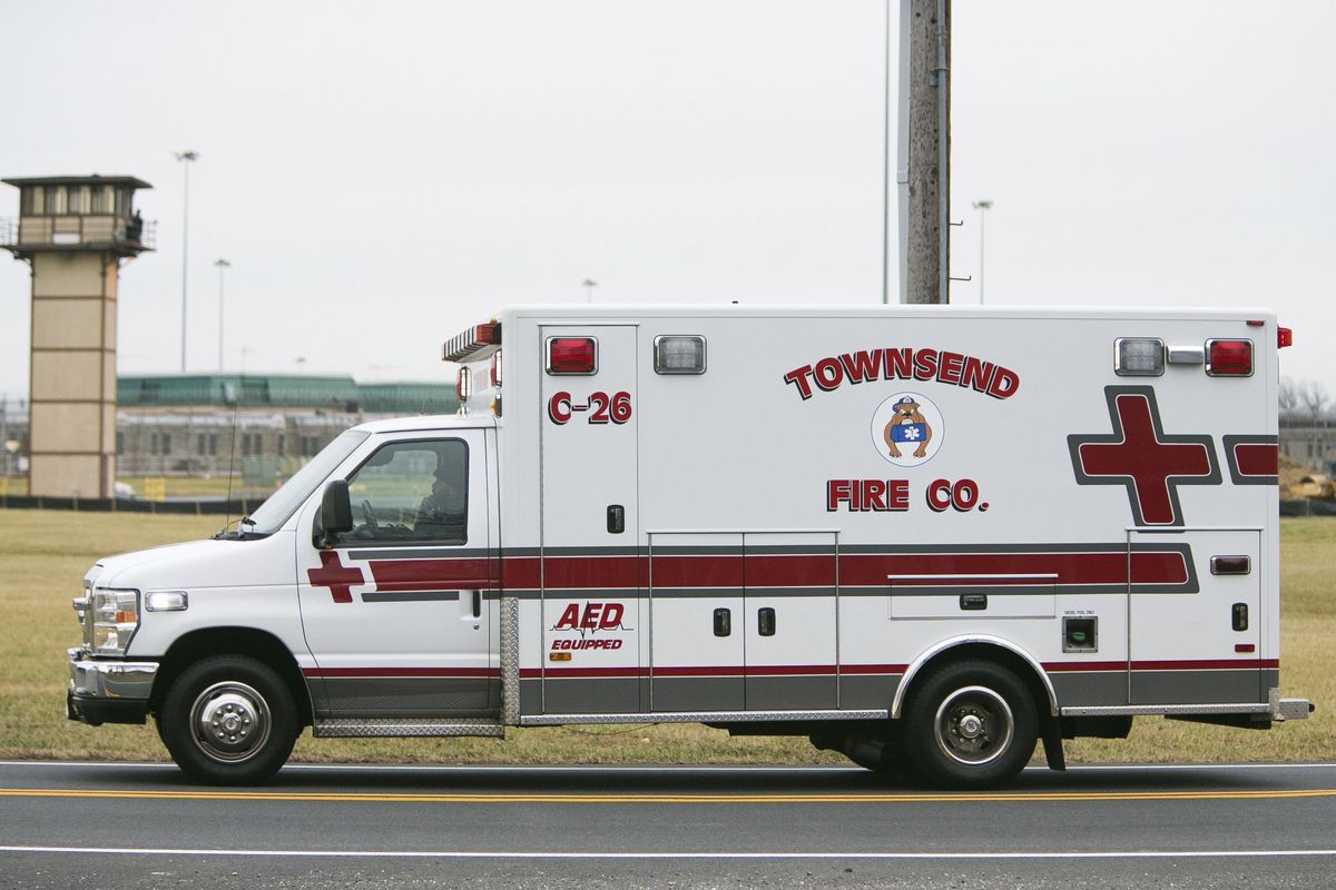 An ambulances drives into the Vaughn Correctional Center near Smyrna, Del., where all Delaware prisons went on lockdown late Wednesday, Feb. 1, 2017. Geoffrey Klopp, president of the Correctional Officers Association of Delaware, said he had been told by the Department of Correction commissioner that prison guards had been taken hostage at the James T. Vaughn Correctional Center in Smyrna. (Suchat Pederson / AP)