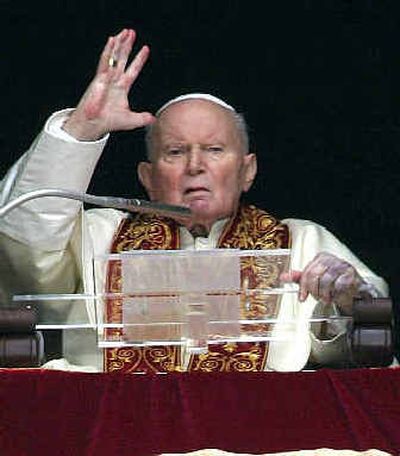 
Pope John Paul II delivers an Easter Sunday blessing from his studio's window overlooking St. Peter's Square. 
 (Associated Press / The Spokesman-Review)