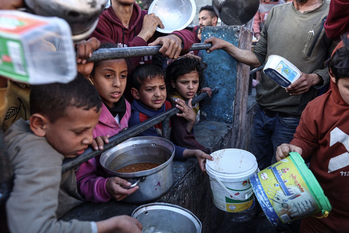 Palestinians line up for food in Rafah, southern Gaza, in March. (MUST CREDIT: Loay Ayyoub for The Washington Post)  (Loay Ayyoub/For The Washington Post)