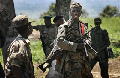 Rebels loyal to Laurent Nkunda’s movement are seen about 50 miles north of Goma, in eastern Congo, on Saturday.  (Associated Press / The Spokesman-Review)