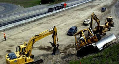 
Construction crews work on the new road bed along the interstate at Sullivan Road. Construction crews work on the new road bed along the interstate at Sullivan Road. 
 (Steve Thompson/Steve Thompson/ / The Spokesman-Review)